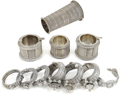 Lot 220 - ELEVEN SILVER AND SILVER ALLOY TRIBAL BRACELETS