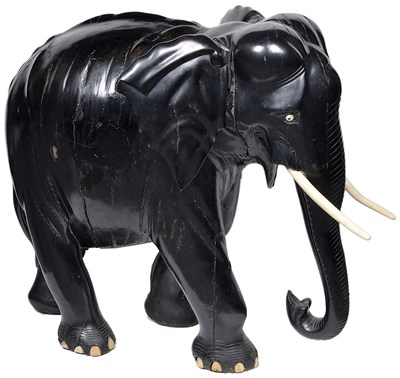 Lot 243 - ~A LARGE EBONY FIGURE OF AN ELEPHANT