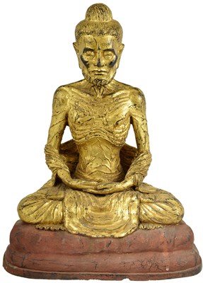 Lot 249 - A LACQUERED GILT-BRONZE FIGURE OF THE EMACIATED BUDDHA