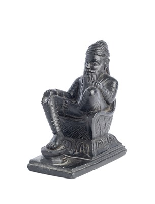 Lot 167 - A SMALL BLACK STONE CARVING DEPICTING RANJIT SINGH, NORTHERN INDIA, LATE 19TH CENTURY