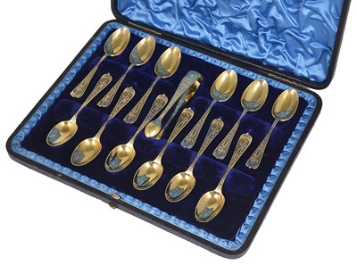 Lot 297 - A SET OF TWELVE VICTORIAN SILVER-GILT COFFEE SPOONS AND A PAIR OF SUGAR TONGS