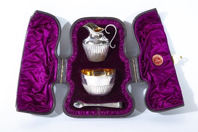 Lot 213 - A CASED VICTORIAN SILVER CREAM JUG AND SUGAR BOWL, CHARLES BOYTON, LONDON, 1884