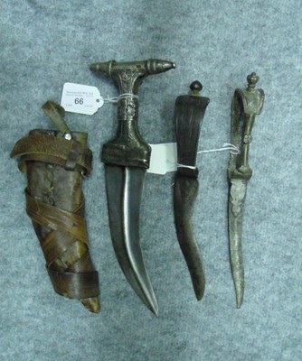 Lot 66 - â€¡ A SILVER-MOUNTED YEMENI DAGGER (JAMBIYA) AND TWO INDIAN DAGGERS (BICHWA)