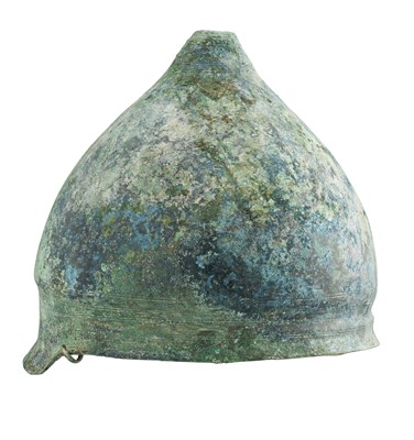 Lot 176 - AN ITALIC BRONZE HELMET OF MONTEFORTINO TYPE