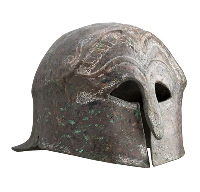 Lot 177 - A GREEK BRONZE HELMET OF PSEUDO-CORINTHIAN TYPE