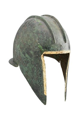 Lot 178 - A GREEK BRONZE HELMET OF ILLYRIAN TYPE