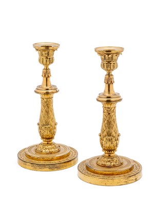 Lot 57 - A PAIR OF GILT-BRONZE CANDLESTICKS, PROBABLY FRENCH SECOND QUARTER 19TH CENTURY