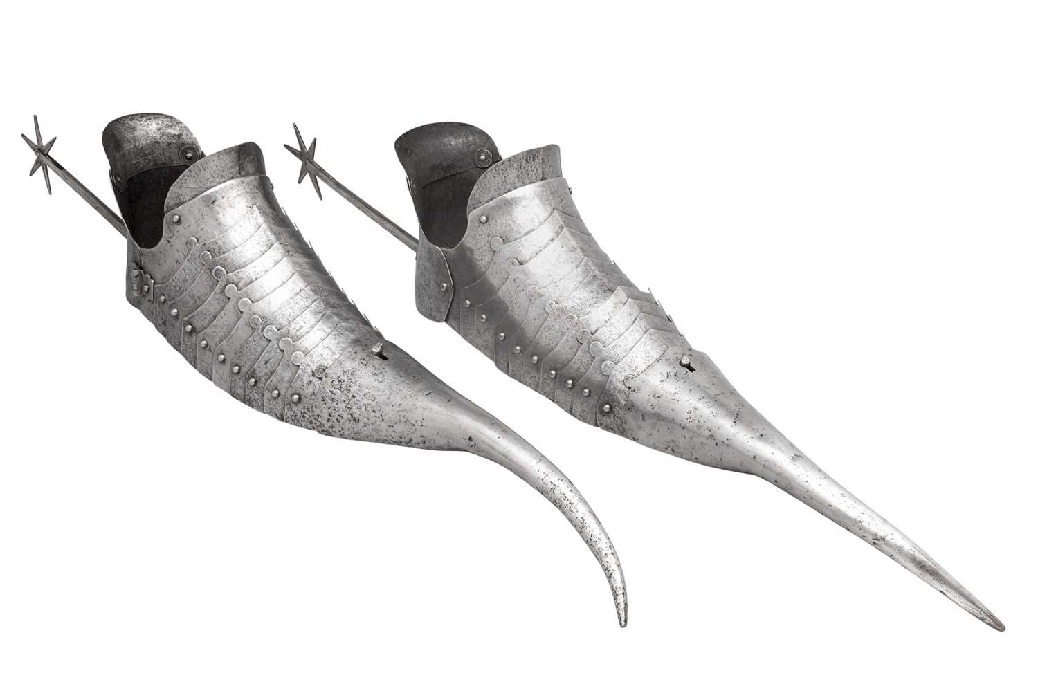 Lot 101 - â€¡A PAIR OF SABATONS IN THE GERMAN 'GOTHIC' STYLE OF THE LATE 15TH CENTURY