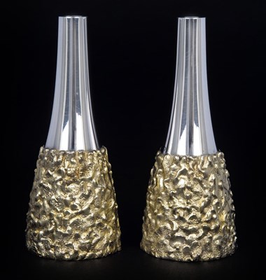 Lot 69 - A PAIR OF PARCEL-GILT-SILVER SALT AND PEPPER SHAKERS