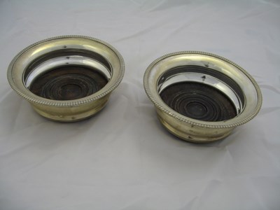 Lot 79 - A PAIR OF SILVER WINE COASTERS