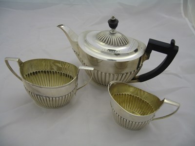 Lot 91 - A SILVER MATCHED THREE-PIECE TEA SET