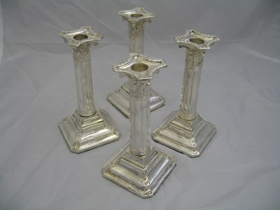 Lot 108 - A SET OF FOUR ELECTROPLATED SHEFFIELD PLATE CANDLESTICKS