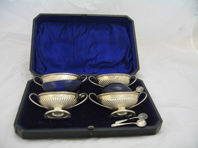 Lot 112 - A SET OF FOUR EDWARDIAN SILVER SALT CELLARS AND FOUR SALT SPOONS