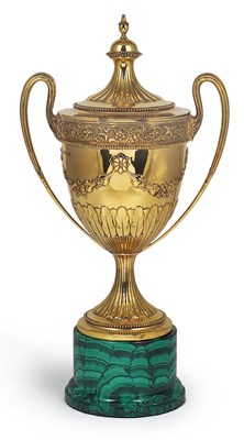 Lot 122 - AN EDWARDIAN SILVER-GILT CUP AND COVER