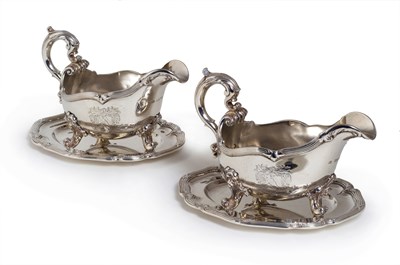 Lot 128 - A PAIR OF VICTORIAN SILVER SAUCEBOATS AND STANDS