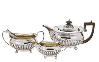 Lot 145 - A GEORGE III SILVER THREE-PIECE SILVER TEA SET