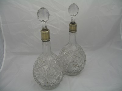 Lot 197 - A PAIR OF CUT GLASS DECANTERS AND STOPPERS