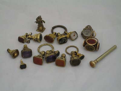 Lot 229 - A COLLECTION OF SEVENTEEN GOLD-CASED OR GILT-METAL FOB SEALS