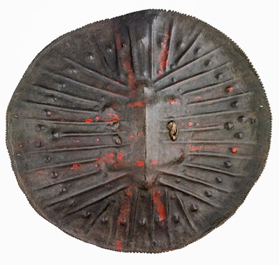 Lot 146 - AN ETHIOPIAN TOOLED HIDE SHIELD